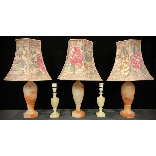 1426 - Interior Decoration - a set of three alabaster slender ovoid table lamps; a brass five branch electr... 