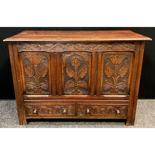 27 - A mid 20th century carved oak mule chest, 77cm high x 107cm wide x 48cm.