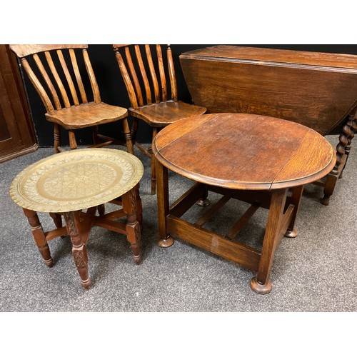 55 - An metamorphic oak armchair / side-table, c.1950, 80cm high x 71cm wide x 57cm (as a chair);  a pair... 