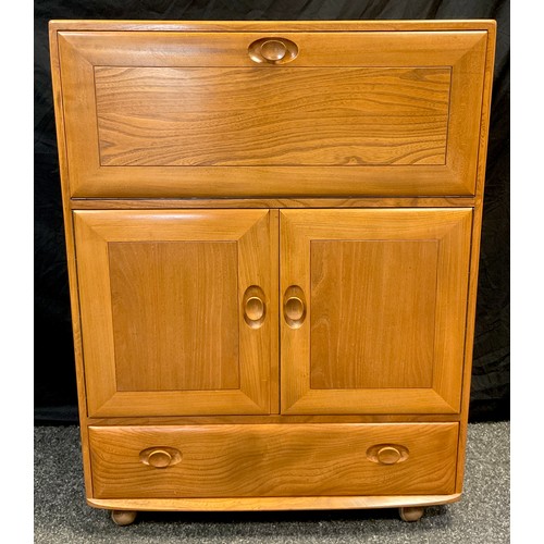 43 - An Ercol ‘Windsor’ model 469 Elm bureau cabinet, 109cm high x 82.5cm wide x 44cm.