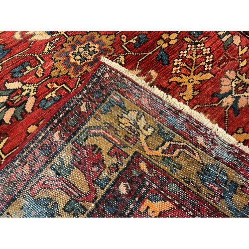 52 - A North west Persian Malayer rug / carpet, hand-knotted with a central field of stylised flowers, an... 