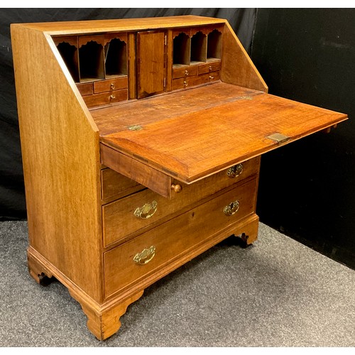 73 - A 19th / early 20th century, George III style reproduction oak bureau, fall door to top enclosing fi... 