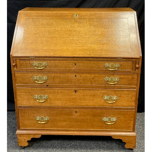 73 - A 19th / early 20th century, George III style reproduction oak bureau, fall door to top enclosing fi... 