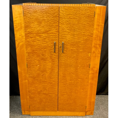 80 - An Art Deco quilted maple double wardrobe, 183cm high x 122cm wide x 50cm deep, and a conforming bed... 