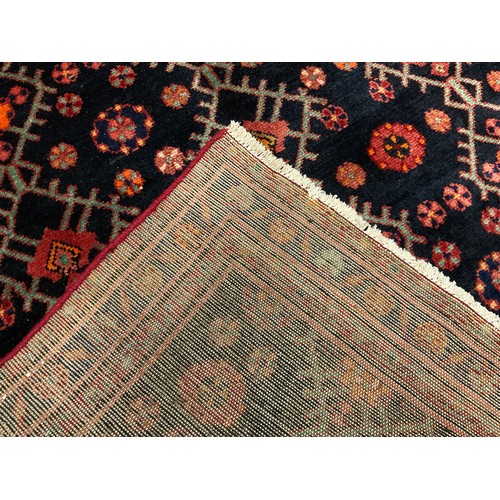 81 - A North west Persian Hamadan rug / carpet, hand-knotted with stylised flowers in tones of red, orang... 