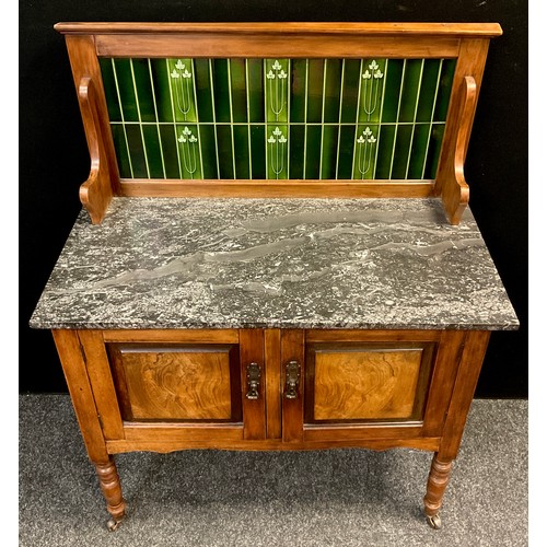 86 - An early 20th century walnut Art Nouveau tile-back washstand, fossil stone top, over pair of cupboar... 