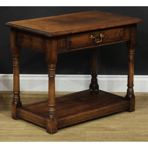 217 - A Titchmarsh & Goodwin style oak side table, 61cm high, 76cm wide, 45cm deep