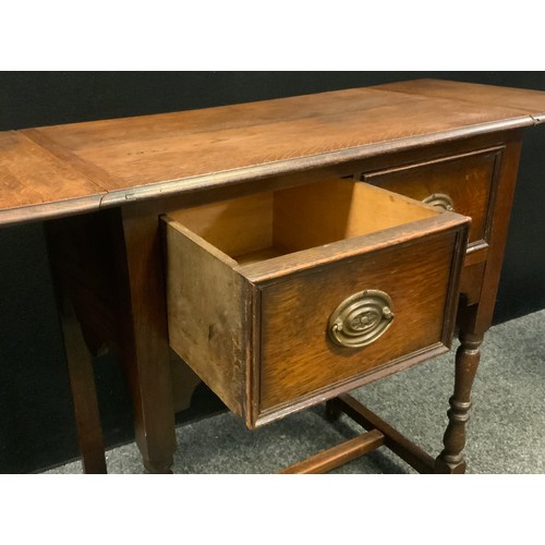 251 - An early 20th century oak side table, rounded rectangular top with fall leaves above a pair of friez... 