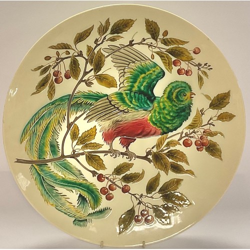7 - A late 19th century continental circular wall charger, impressed in low relief with a fanciful bird ... 