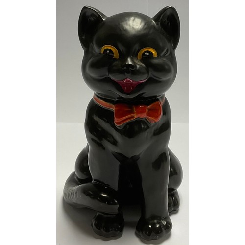 12 - In the manner of Wilkinson Pottery, after Louis Wain, The Laughing Cat, red bow tie, yellow eyes, 19... 