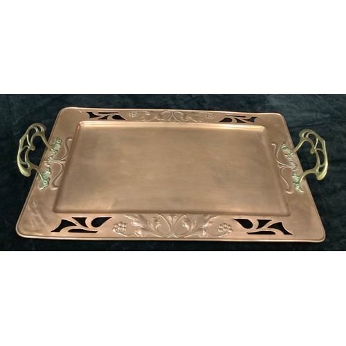 13 - An Art Nouveau WMF two handled copper tray, embossed with fruiting vine, pair of openwork brass hand... 