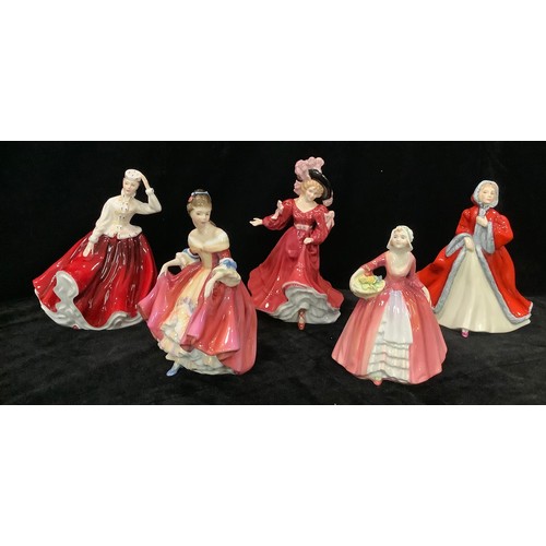 58 - A collection of Royal Doulton figurines, comprising HN2229 Southern Belle, HN3365 figure of the year... 