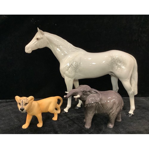 169 - A Beswick model of an Elephant, trunk raised; a Beswick model of a Lion Cub; a Beswick model of a da... 