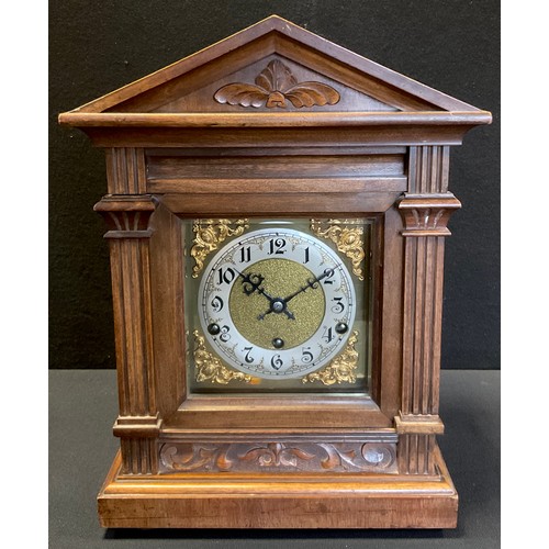 54 - An early 20th century German Bracket clock, 31-day chiming movement, brass dial with Arabic numerals... 