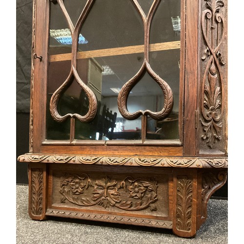 62 - A Victorian, ornately carved oak corner cabinet, wall-mounted, 90.5cm high x 58.5cm wide x 35cm, c.1... 