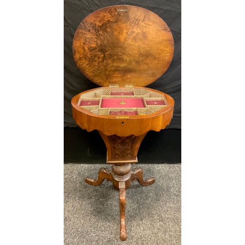 89 - A Victorian walnut oval work table, the quarter veneered top inlaid with stylised foliage, the inter... 