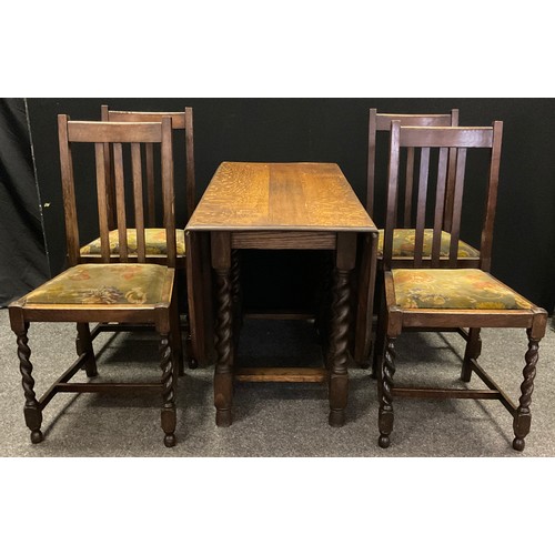 380 - An early 20th century oak gate-leg dining table, rounded rectangular top, barley-twist supports, 71.... 