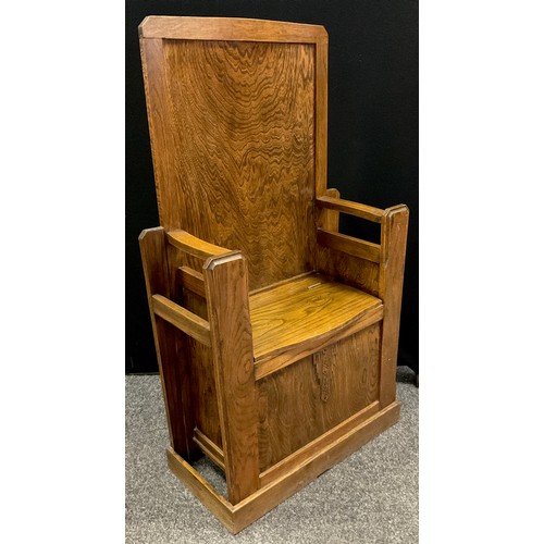 387 - An Arts and Crafts style oak hall seat, high back, chest compartment to seat, stick-stand sides, 118... 