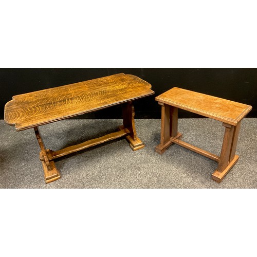 393 - An Arts and Crafts style oak stool, 42.5cm high x 52cm x 22.5cm;  a c.1930’s oak trestle coffee tabl... 