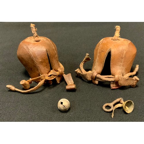 426 - A near pair of Falconry Rufters, (Bird Hoods) with bells (2)