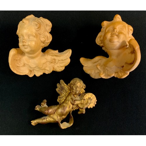 427 - A pair of figures wall masks, as Cherub, another gilt (3)