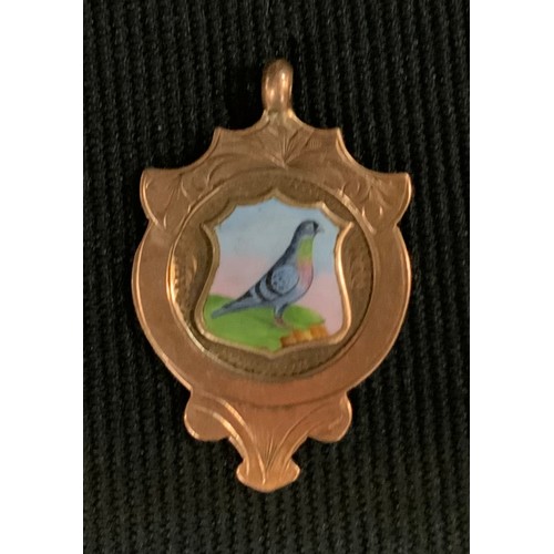 516 - A 9ct gold enamelled Pidgeon racing shield medal, Green Lane Homing Society, Combined Average, 1925,... 