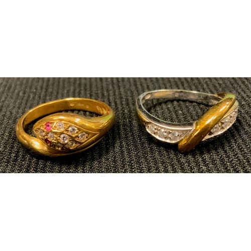 526 - A yellow and white metal snake ring, marks worn, 4.7g gross;  another yellow metal, stamped 957AR 75... 