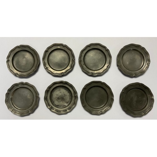 83 - An unusual set of eight George III 18th/19th century pewter shaped circular counter dishes, 9cm in d... 