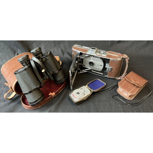 214 - A Polaroid land camera model 95, Sekonic light meter, Fasco binoculars model 70363.