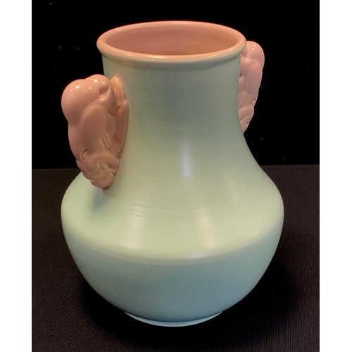 9 - A large Poole Art Deco Dove handled vase, possibly designed by John Adams, green ridged body, buff/p... 