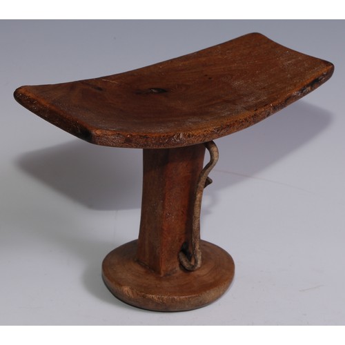 27 - Tribal Art - an Ethiopian headrest, 20.5cm wide; another (2)