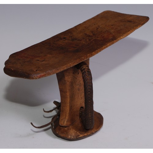 27 - Tribal Art - an Ethiopian headrest, 20.5cm wide; another (2)