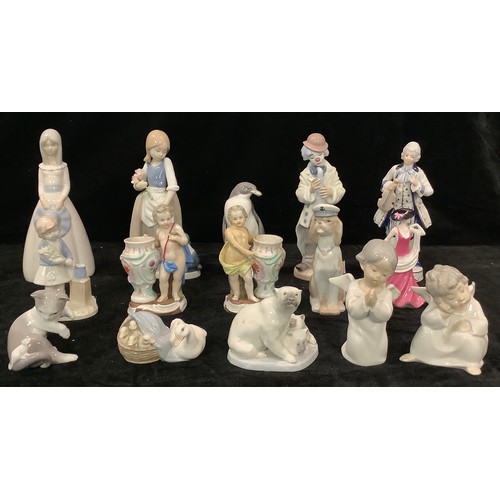 111 - A Lladro figure, Sad Sax, 5471, 23cm high; others, Cat and Mouse, Duck and Ducklings, Cherubs, Polar... 