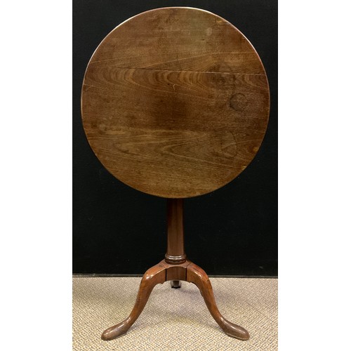 62 - A George III mahogany ‘Gun-barrel’ tripod table, circular top, slightly tapered cylindrical pedestal... 