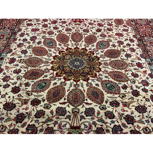 64 - A Persian Tabriz hand-knotted rug / carpet, wool and silk mix, with central circular medallion withi... 