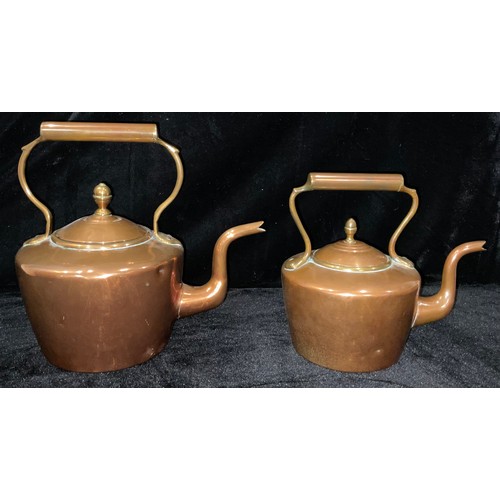 125 - A Victorian copper kettle, acorn finial, 30cm; another smaller, 24cm (2)