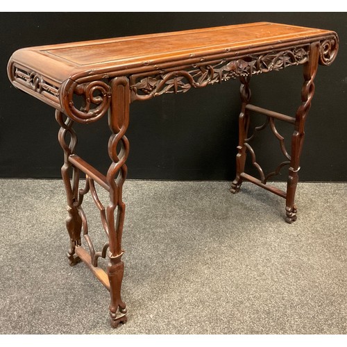 86 - A late 19th / early 20th century Chinese carved padauk wood Altar table, the frieze carved as scroll... 