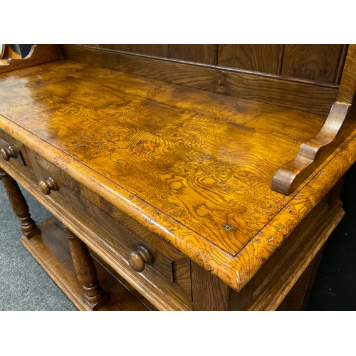 101 - A Pollard Oak Welsh Dresser in the manner of Rupert Griffiths, two tier plate rack top, pair of shor... 