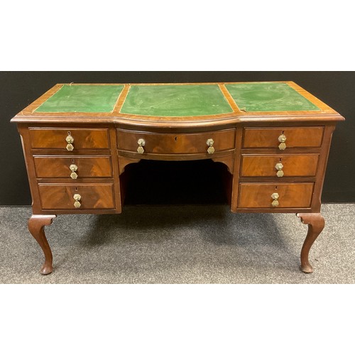 124 - A mid 20th century mahogany knee-hole writing desk, bow-front centre, single drawer to frieze, three... 