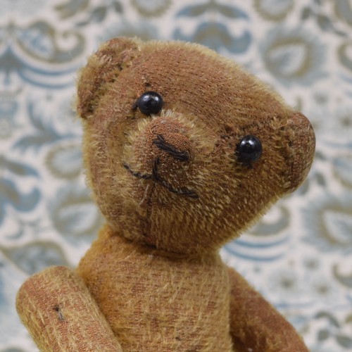 6002 - An early 20th century golden mohair jointed teddy bear, black boot button eyes, pronounced snout wit... 