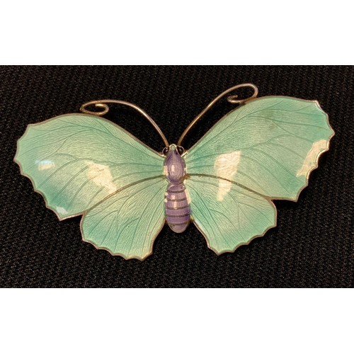 426 - An enamelled sterling silver butterfly brooch, aquamarine wings,  purple body, John Aitken & sons, n... 