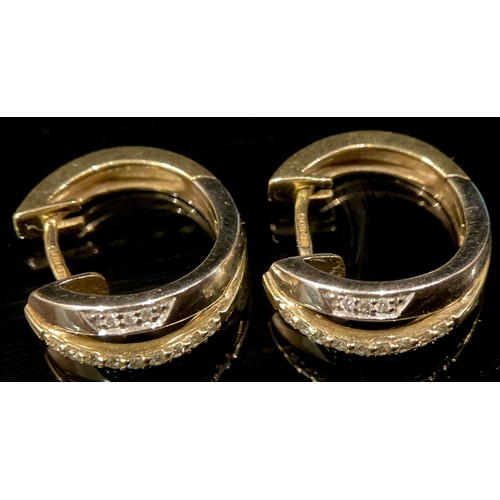 429 - A pair of yellow and white gold diamond accented earrings, 9ct gold mounts, 3.5g gross