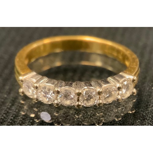 430 - A diamond and 18ct gold six stone ring, each round brilliant cut stone approximately 0.09ct, size J/... 