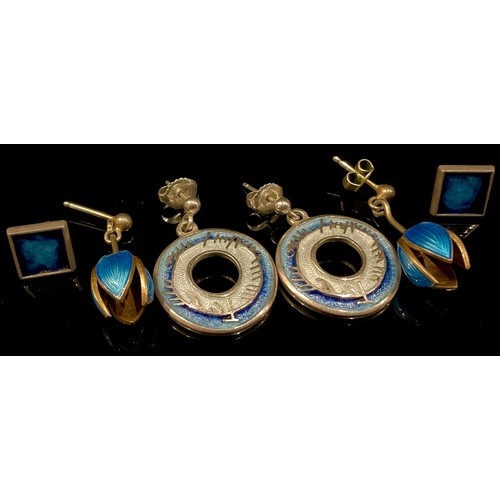 431 - Three pairs of blue enamelled silver earrings, 12g gross