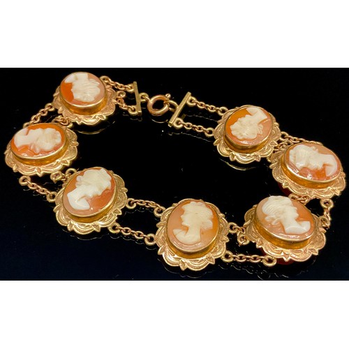 433 - A 9ct gold mounted seven panel cameo bracelet, stamped 375, 14.1g gross