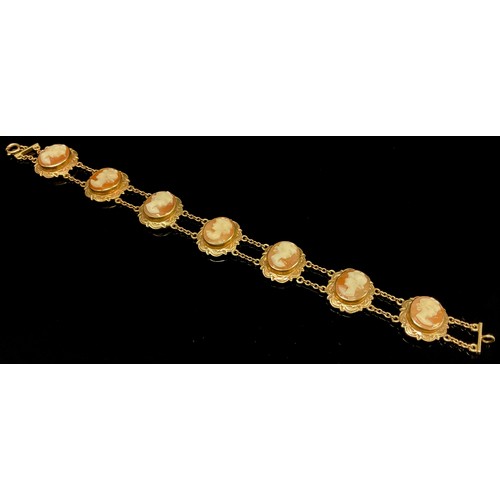 433 - A 9ct gold mounted seven panel cameo bracelet, stamped 375, 14.1g gross