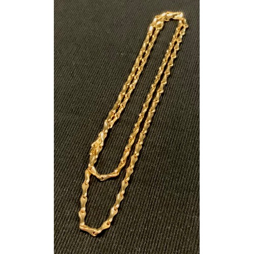 437 - A 9ct gold twisting fancy link necklace, 74cm long, import marks, London 1986, 35g,