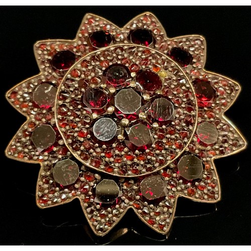 440 - A 19th century dark red garnet flower head brooch, unmarked yellow metal mount, 8g gross