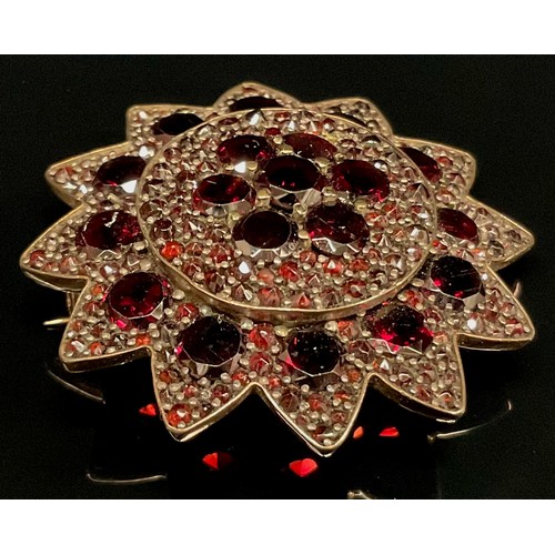 440 - A 19th century dark red garnet flower head brooch, unmarked yellow metal mount, 8g gross