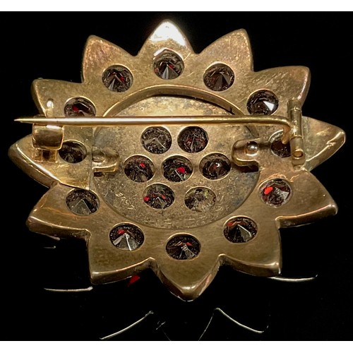 440 - A 19th century dark red garnet flower head brooch, unmarked yellow metal mount, 8g gross